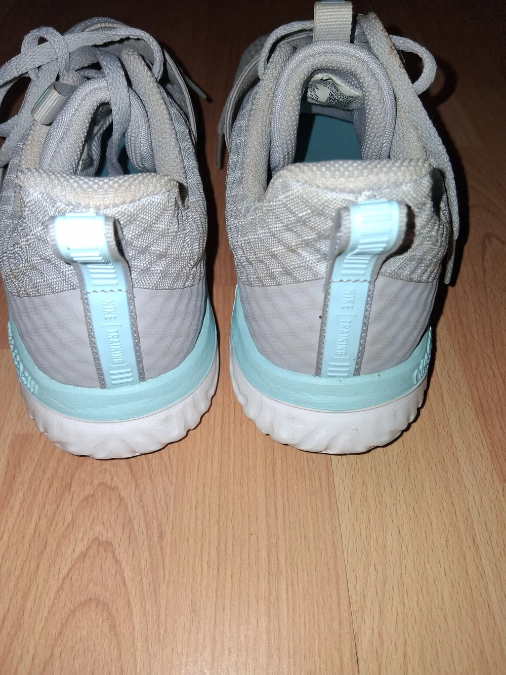 Nike Women's Light Gray Sneakers with Mint Accents